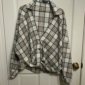 Shein button down oversized flannel.  Bottom is fastened together.  Tan/black.